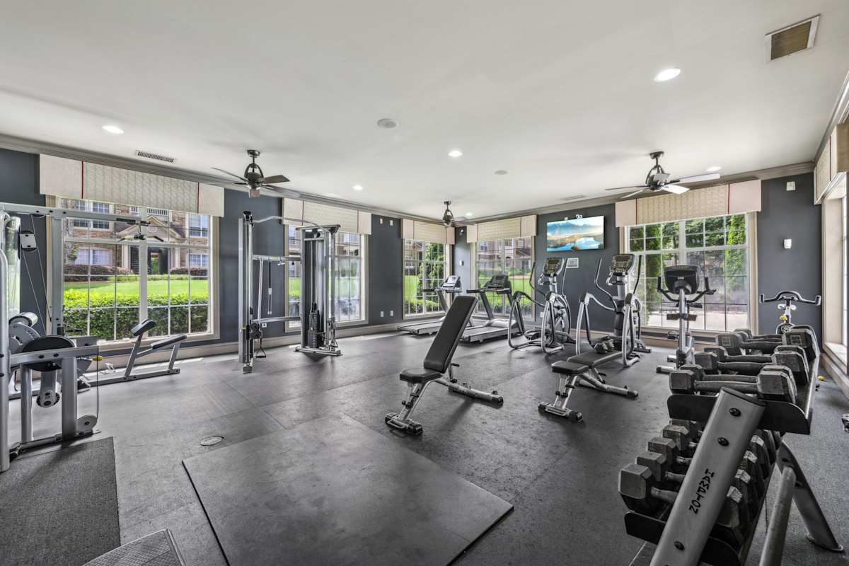 Wesley Providence Apartments at Stonecrest fitness center with cardio and weight equipment - Stonecrest, GA