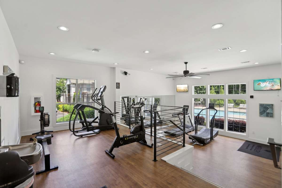 Arbor Mill Apartments at Norcross fitness center with cardio equipment - Norcross, GA