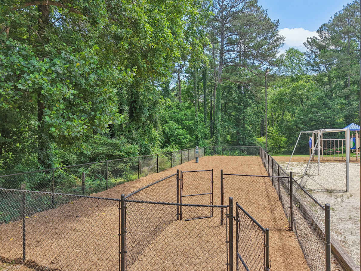 Wesley Trevento Apartments at Lithia Springs dog park with fenced run - Lithia Springs, GA