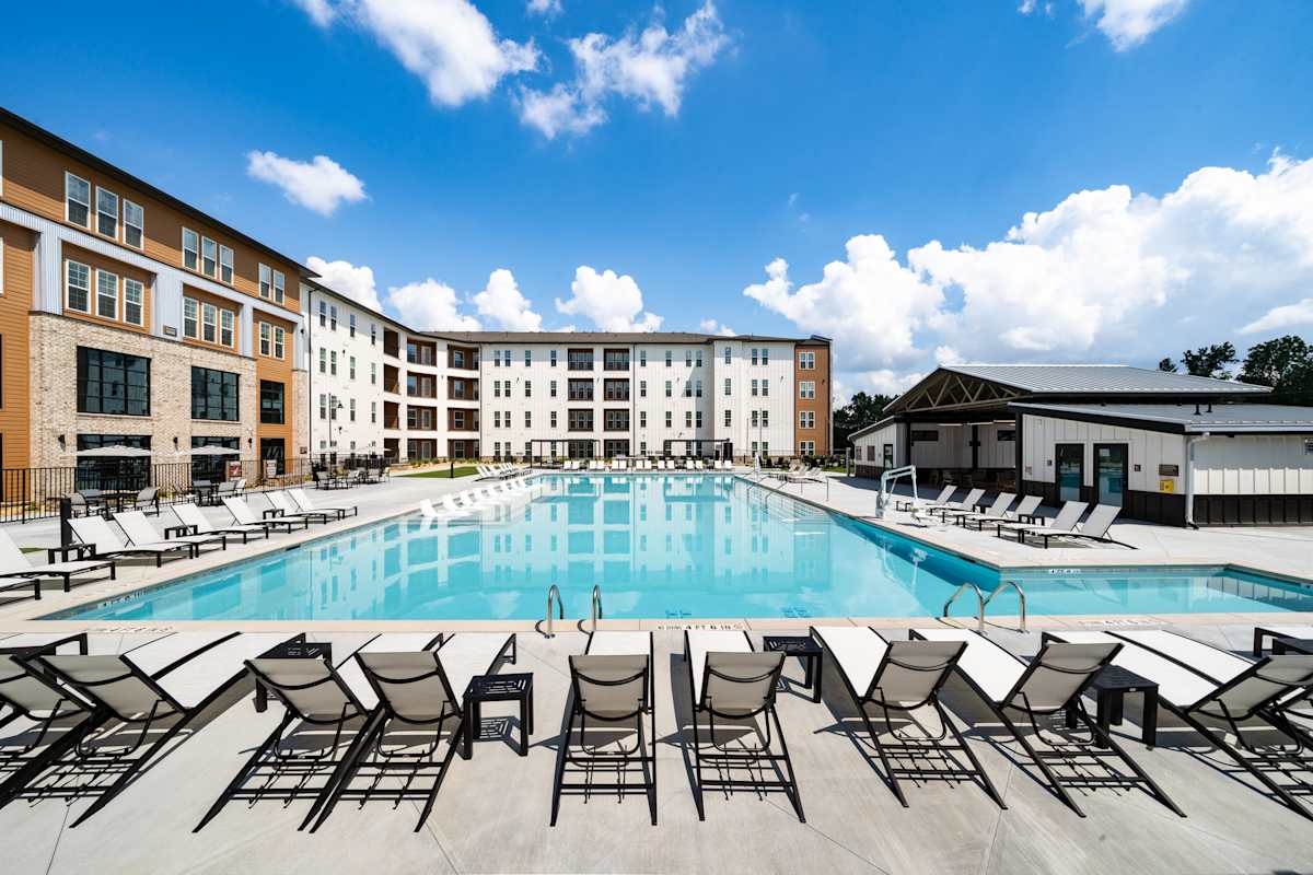 Heron Mill Apartments at Douglasville pool and sun loungers - Douglasville, GA
