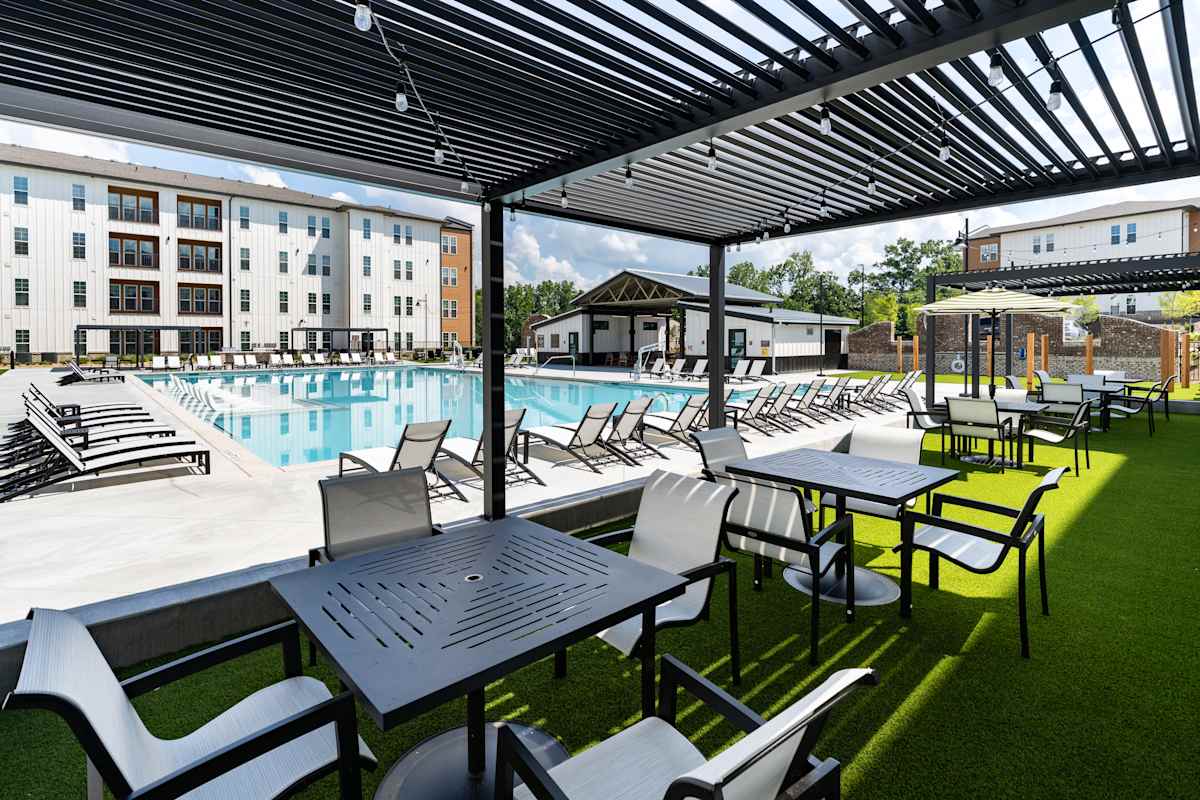 Heron Mill Apartments at Douglasville poolside seating area - Douglasville, GA