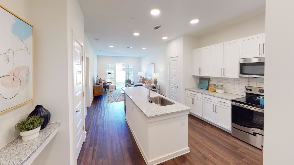 Station 75 Apartments at McDonough model kitchen with granite counters - Locust Grove, GA