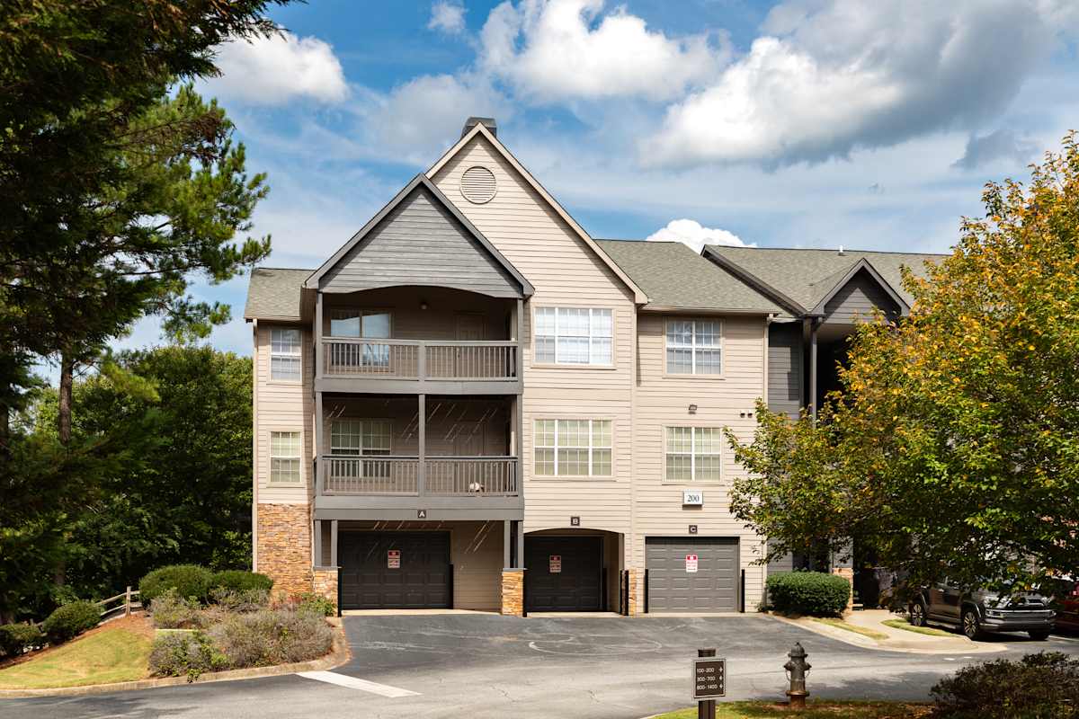 Wesley Hampstead Apartments at Douglasville exterior building with balconies and garages - Lithia Springs, GA