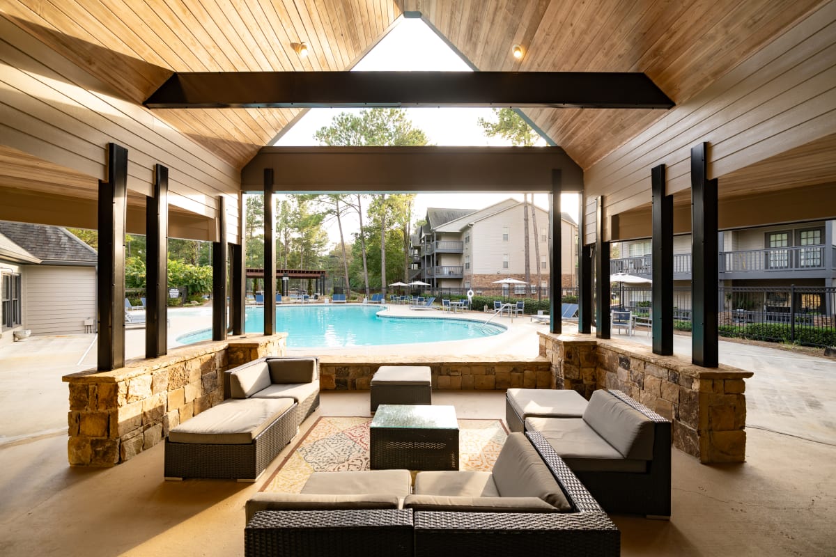 Wesley Hampstead Apartments at Douglasville poolside lounge with sectional seating - Lithia Springs, GA
