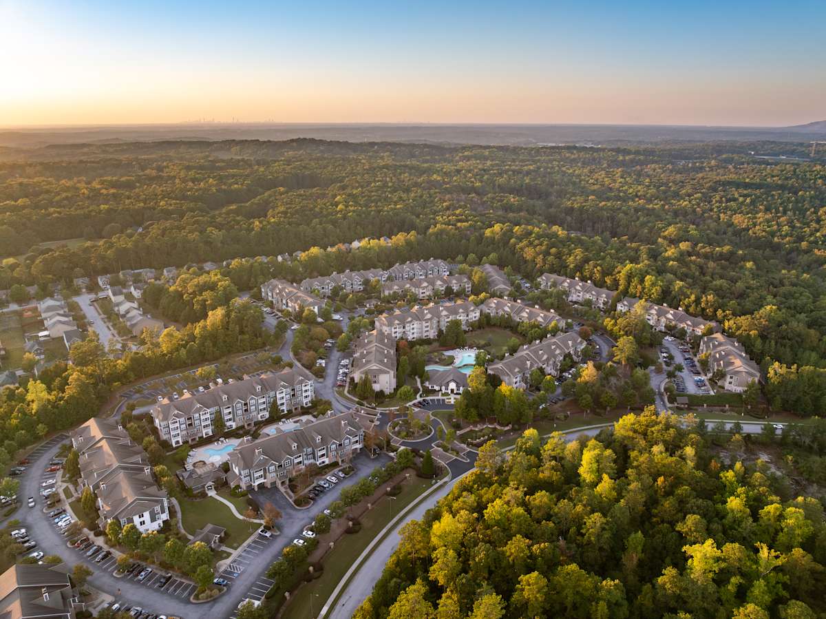 Wesley Kensington Apartments at Stonecrest aerial view at twilight - Stonecrest, GA