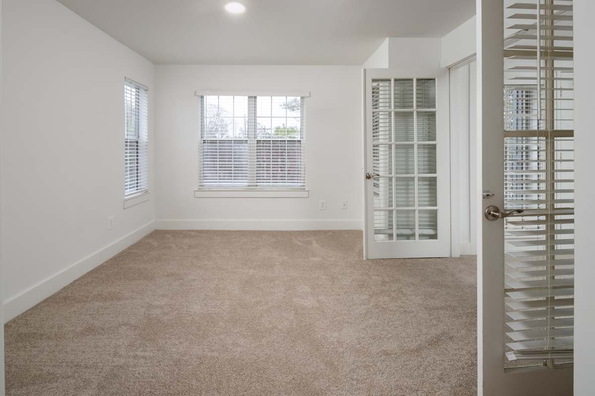 Wesley St. Claire Apartments at Lawrenceville French door room - Lawrenceville, GA
