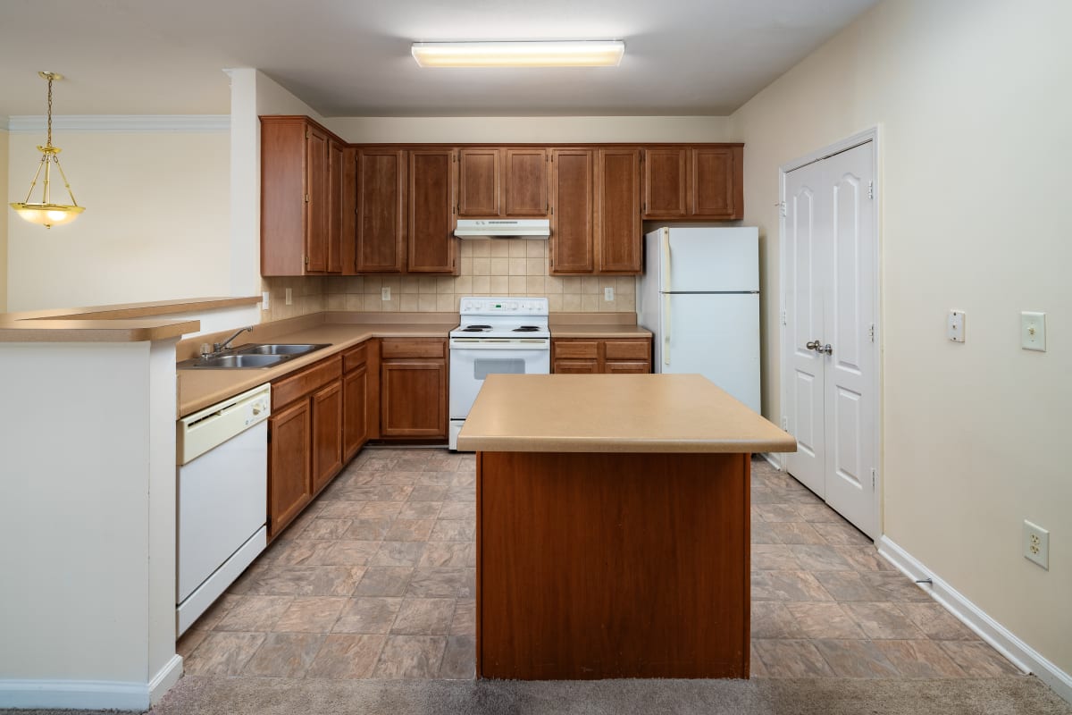 Modern kitchen with island at Wesley Stonecrest Apartments - Stonecrest, GA