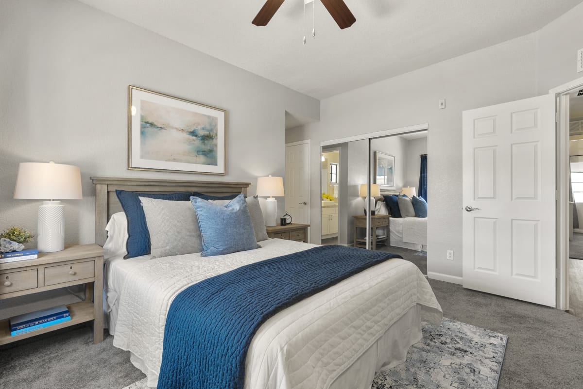 Furnished bedroom shown — representative home at Vaseo Apartments.