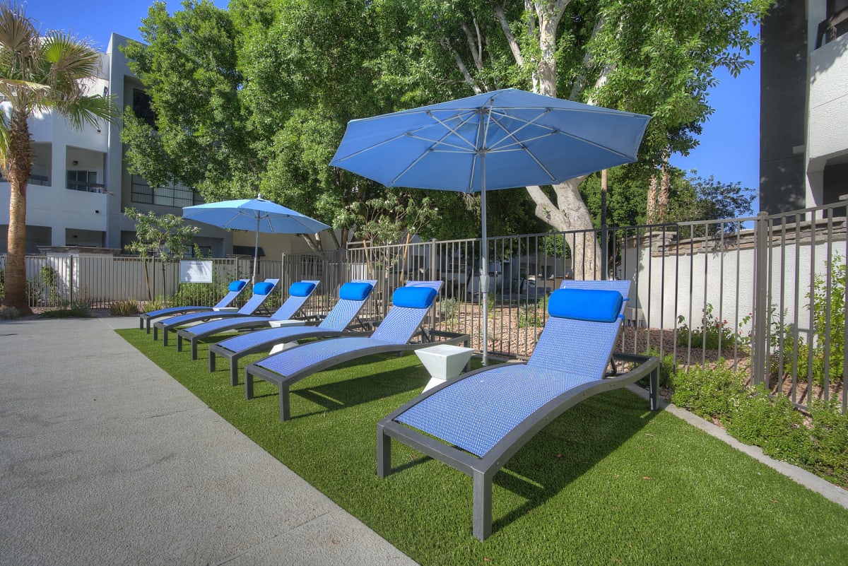 Pool and poolside area at Vaseo Apartments.