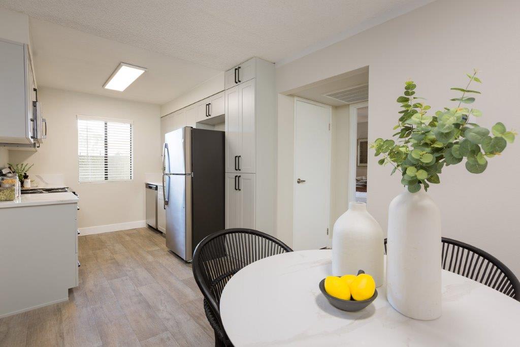 Furnished dining area shown — representative home at Reveal.