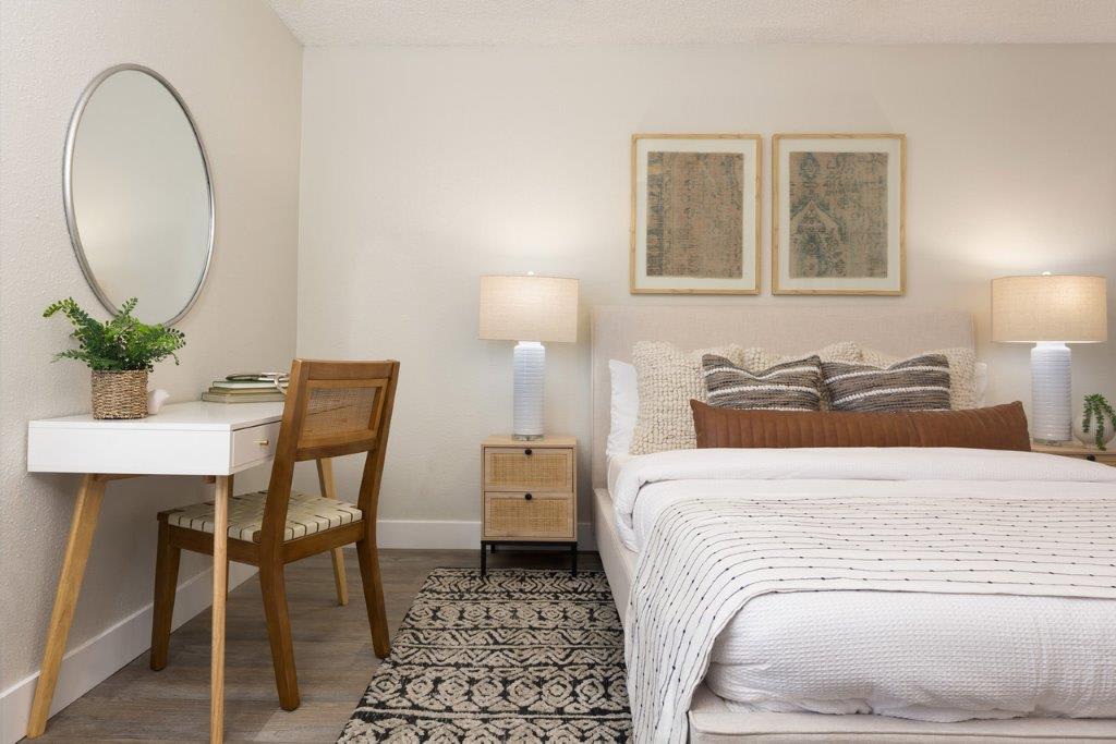 Furnished bedroom shown — representative home at Reveal.