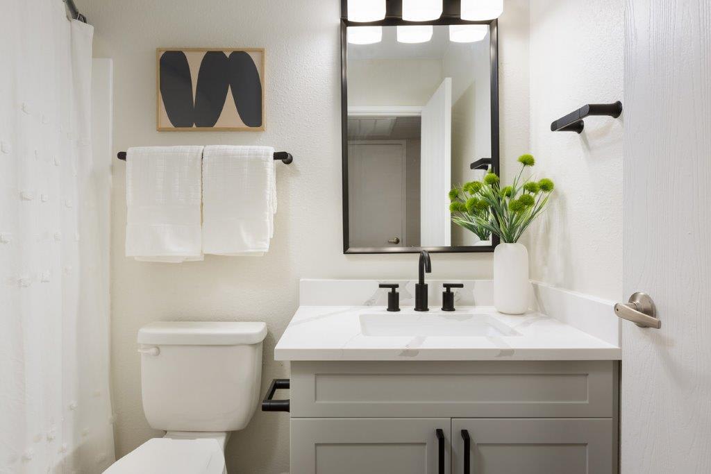 Apartment bathroom — representative home at Reveal.