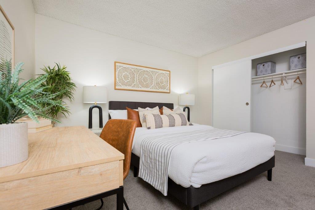 Furnished bedroom shown — representative home at Reveal.
