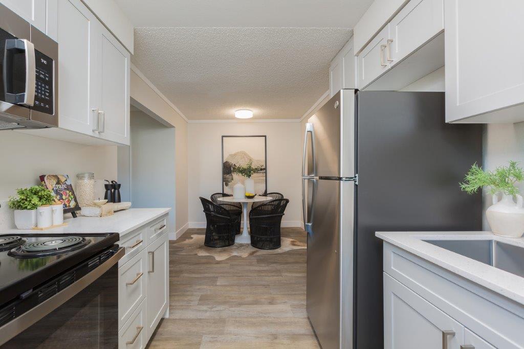 Apartment kitchen — representative home at Reveal.