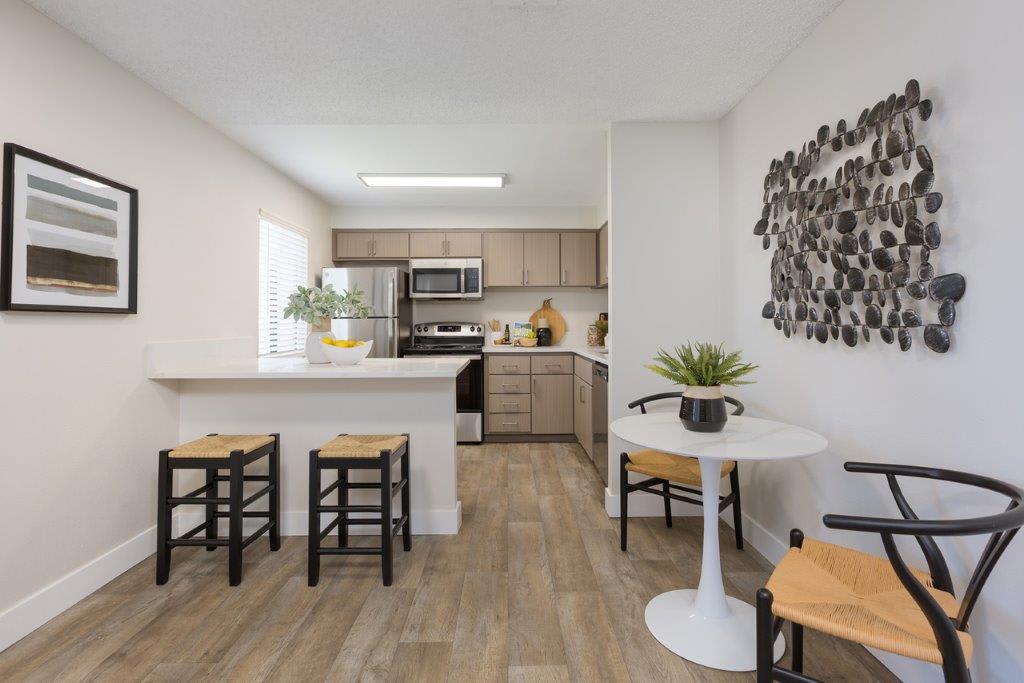 Furnished dining area shown — representative home at Reveal.