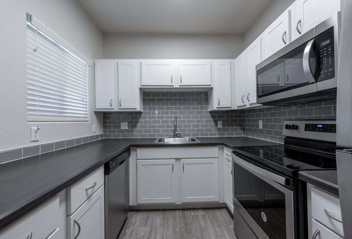 Apartment kitchen — representative home at Bayside Apartments.
