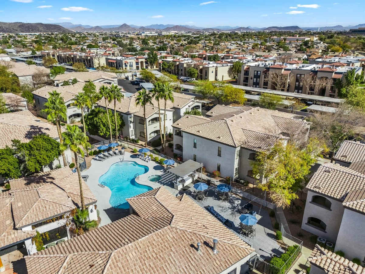 Pool and poolside area at Bayside Apartments.