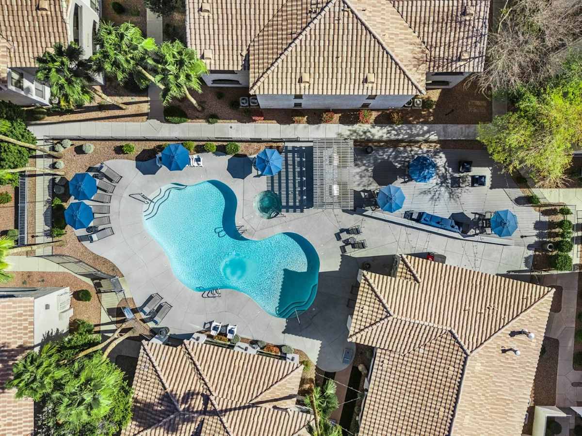 Pool and poolside area at Bayside Apartments.