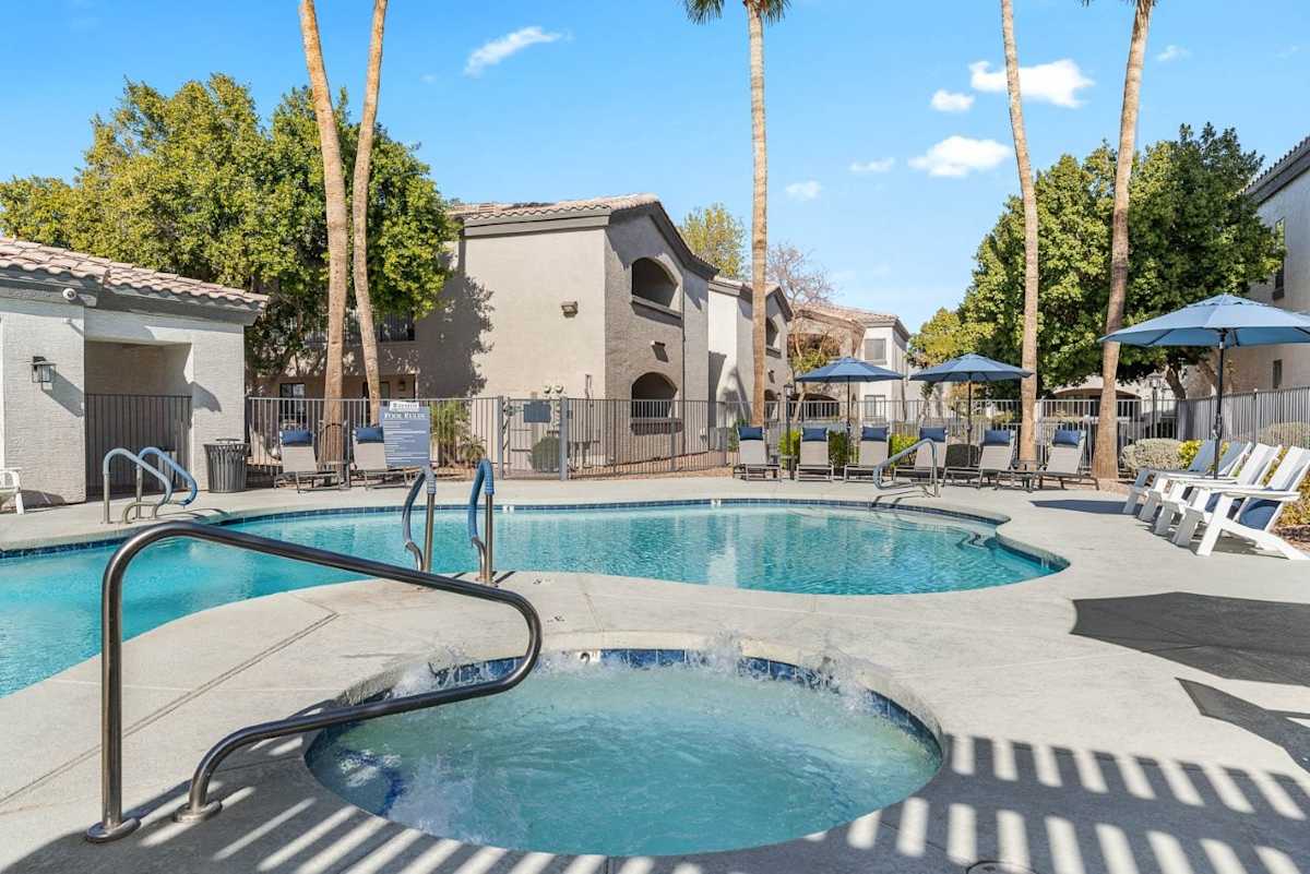 Pool and poolside area at Bayside Apartments.