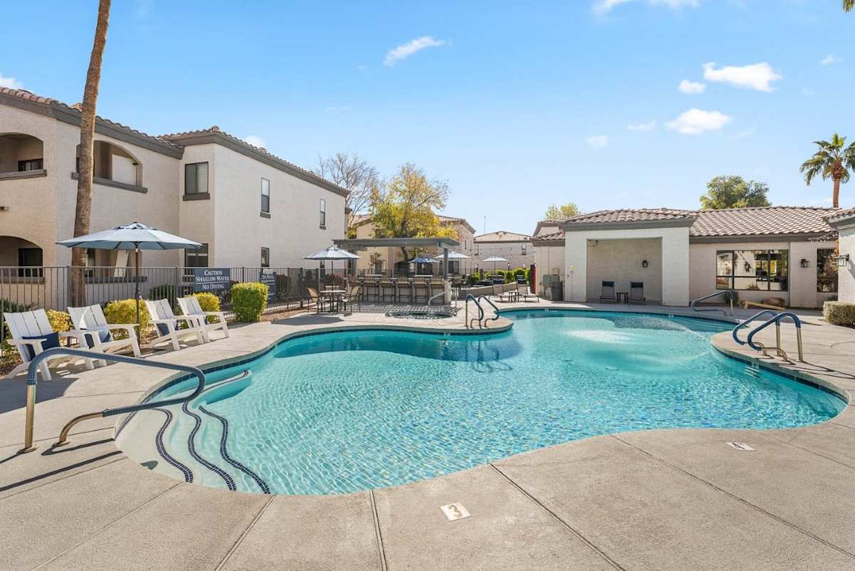 Pool and poolside area at Bayside Apartments.