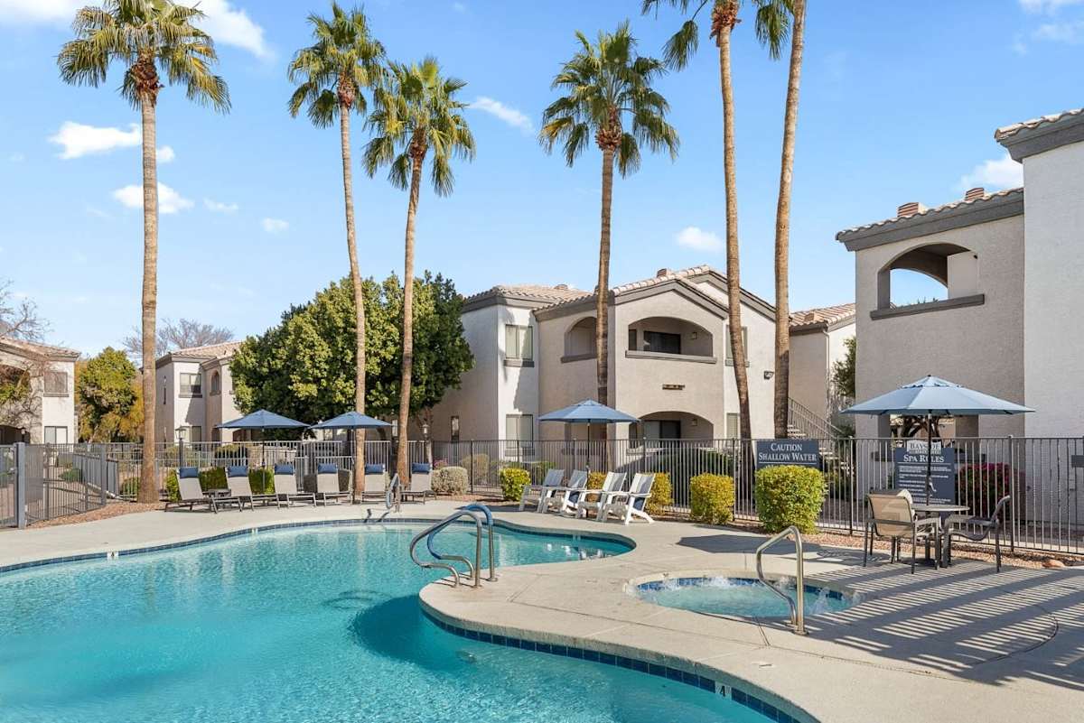 Pool and poolside area at Bayside Apartments.