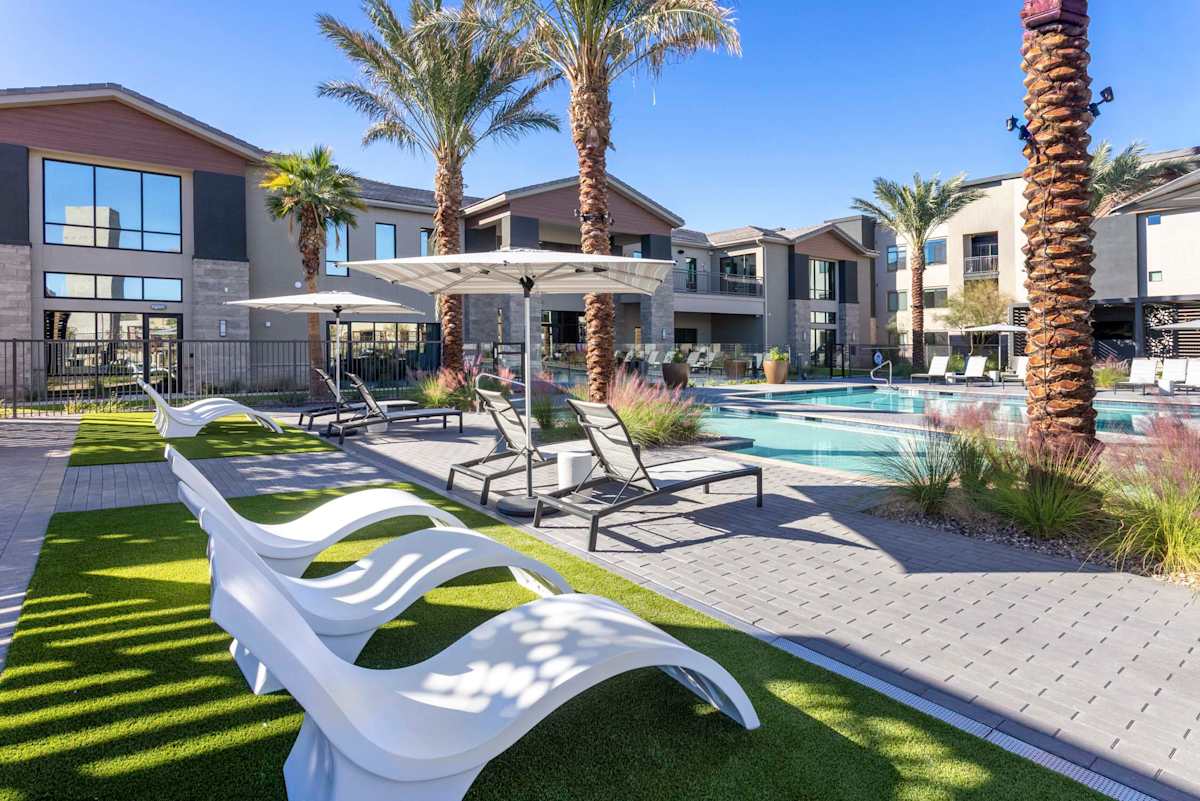 Poolside lounge chairs and lawn at Elysium.