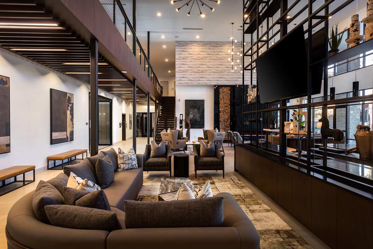Double-height community lounge at Elysium.