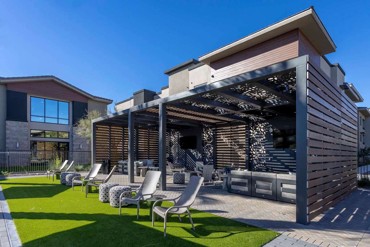 Lawn and covered outdoor lounge at Elysium.