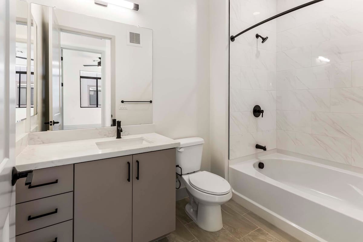 Bathroom with tub and shower at Elysium.