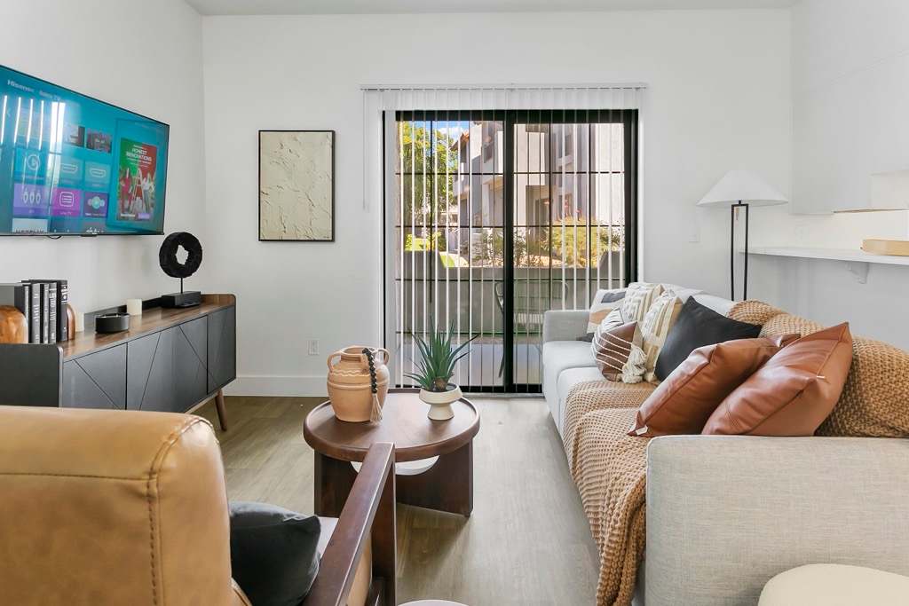 Furnished living area and kitchen at Diamonte on Bell.