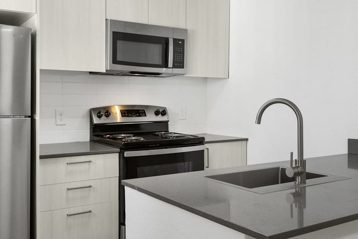 Apartment kitchen — representative home at Villa de Cortez.