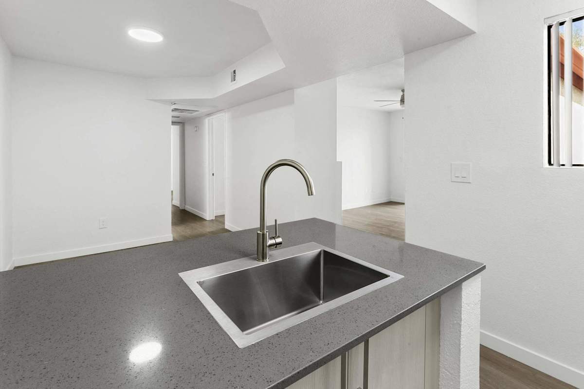 Apartment kitchen — representative home at Villa de Cortez.