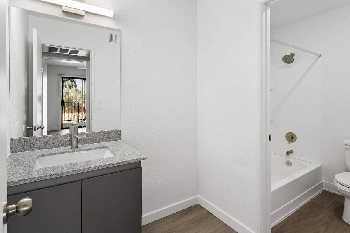 Apartment bathroom — representative home at Villa de Cortez.