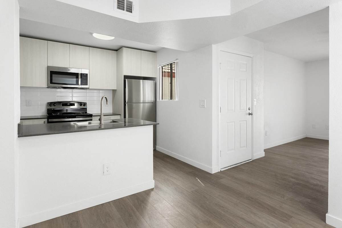 Apartment kitchen — representative home at Villa de Cortez.