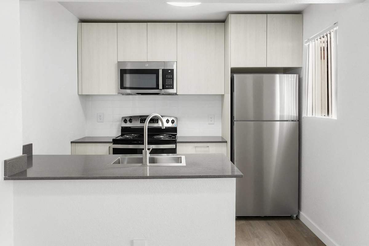 Apartment kitchen — representative home at Villa de Cortez.