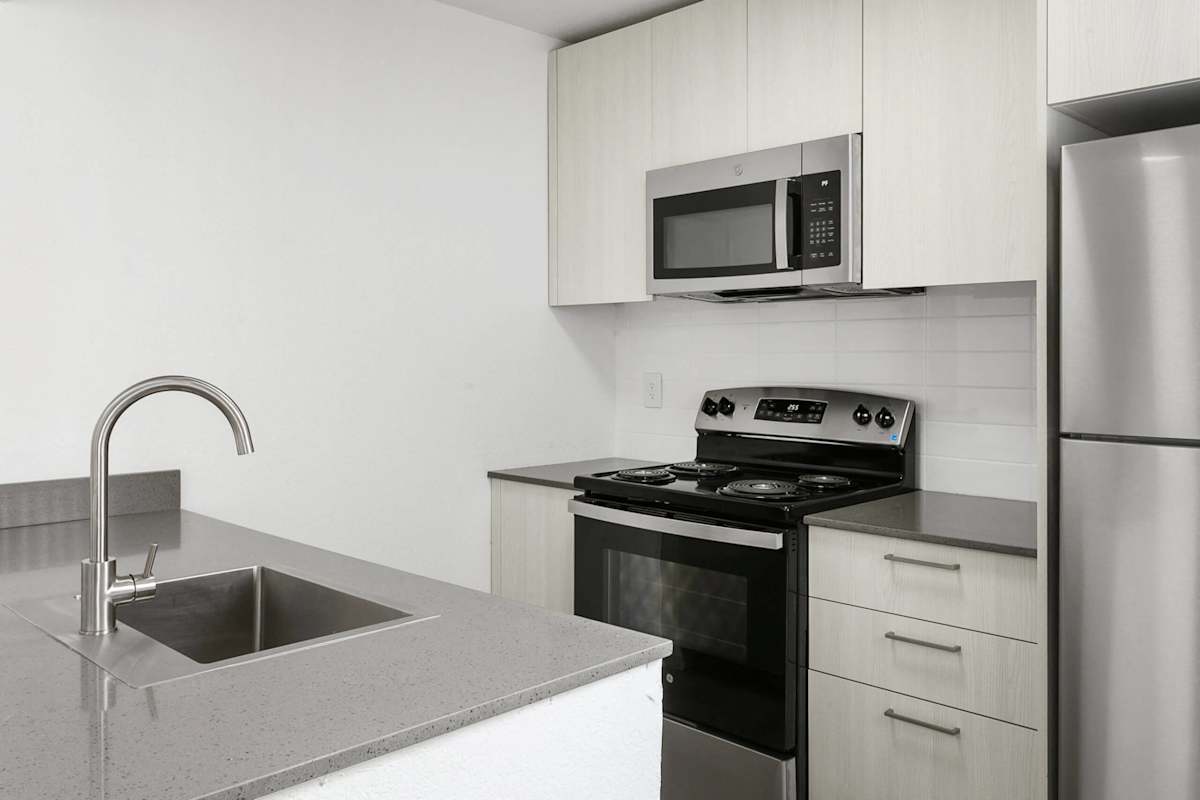 Apartment kitchen — representative home at Villa de Cortez.