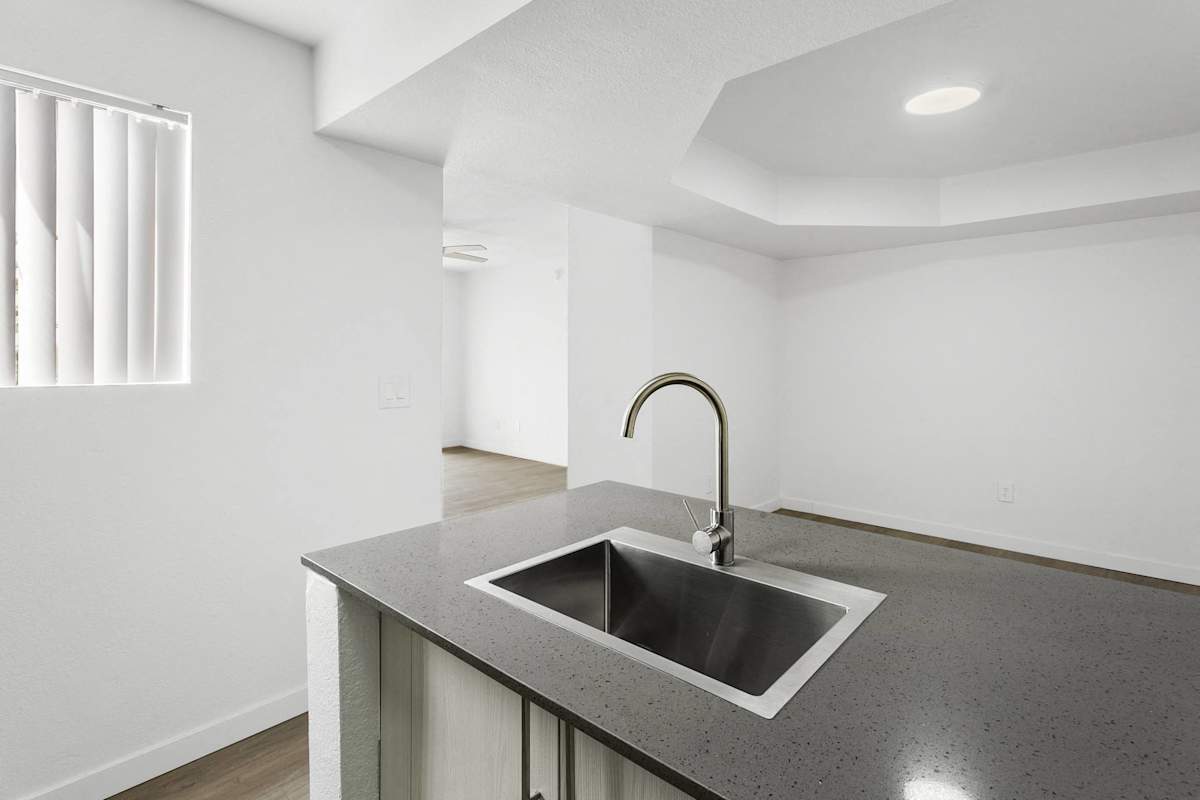 Apartment kitchen — representative home at Villa de Cortez.