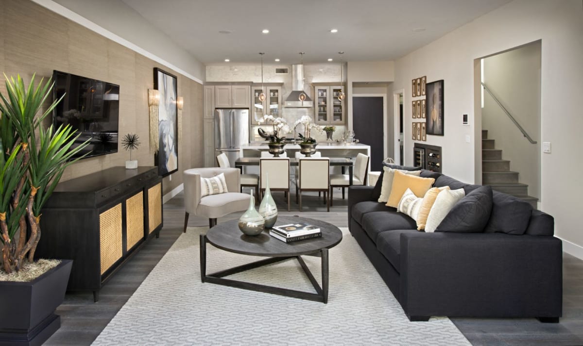 Furnished apartment living area shown — representative home at Novella at Arcadia.