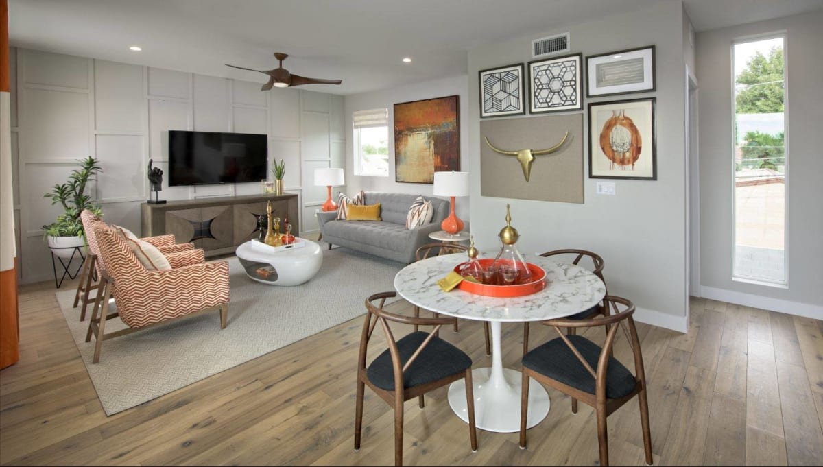 Furnished apartment living area shown — representative home at Novella at Arcadia.