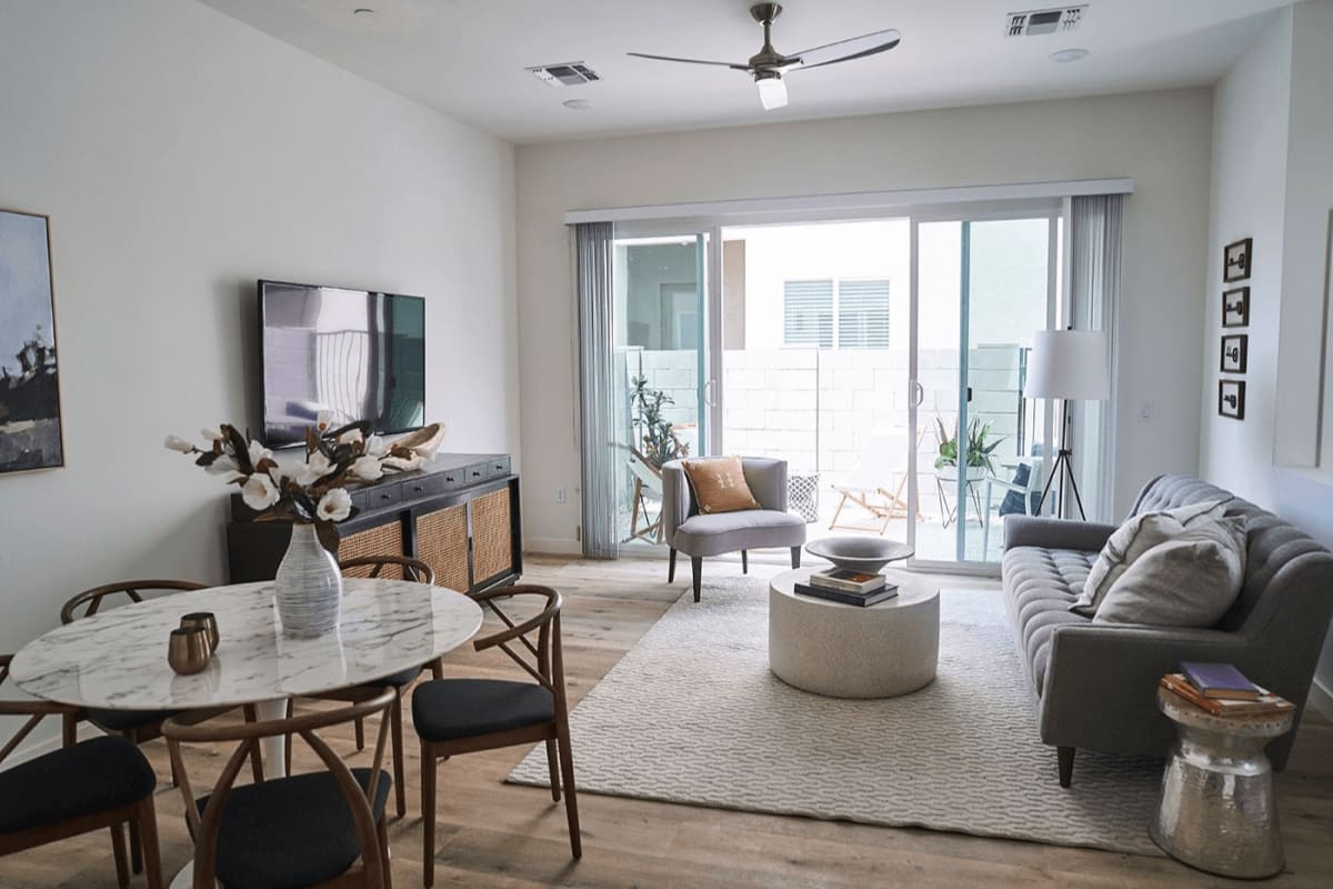 Furnished apartment living area shown — representative home at Novella at Biltmore.