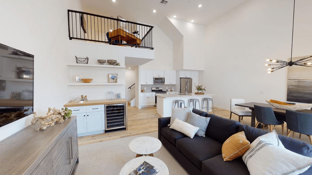 Furnished apartment living area shown — representative home at Novella at Biltmore.