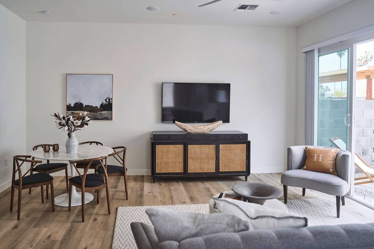 Furnished apartment living area shown — representative home at Novella at Biltmore.
