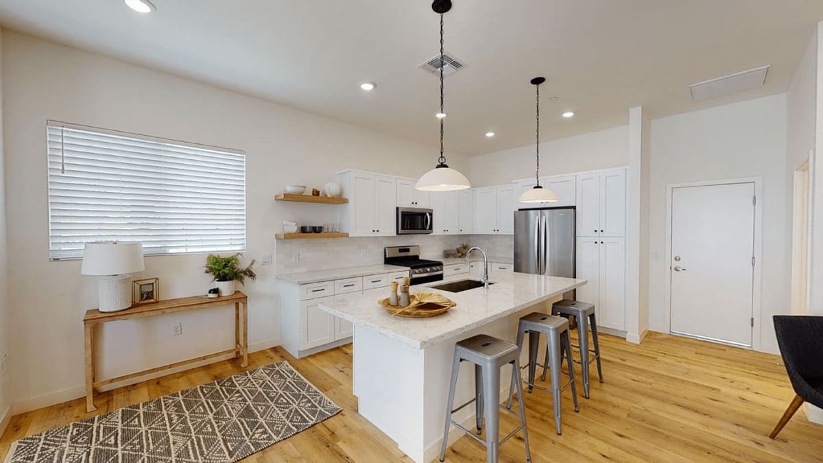 Apartment kitchen — representative home at Novella at Biltmore.