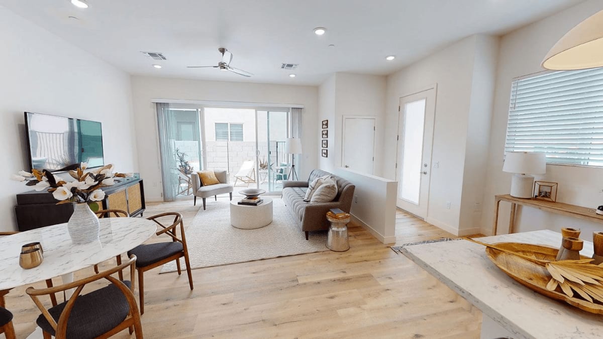 Furnished apartment living area shown — representative home at Novella at Biltmore.