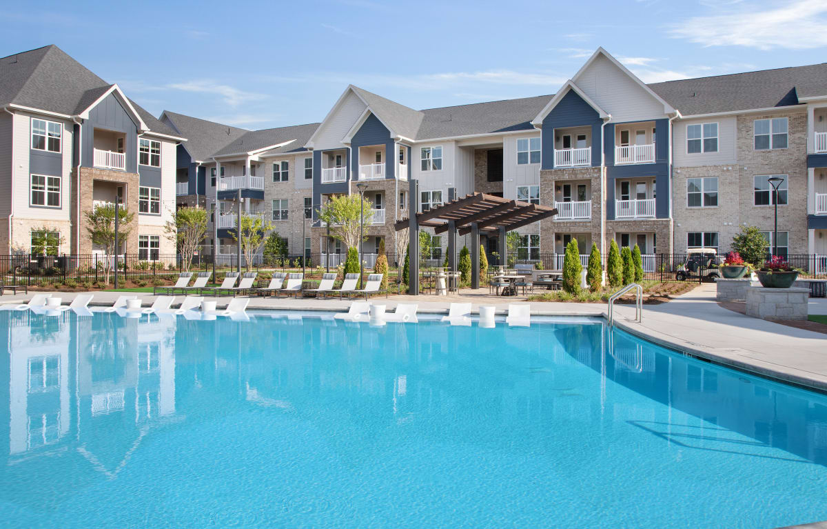 Celadon on Club Apartments swimming pool with loungers - Lawrenceville, GA