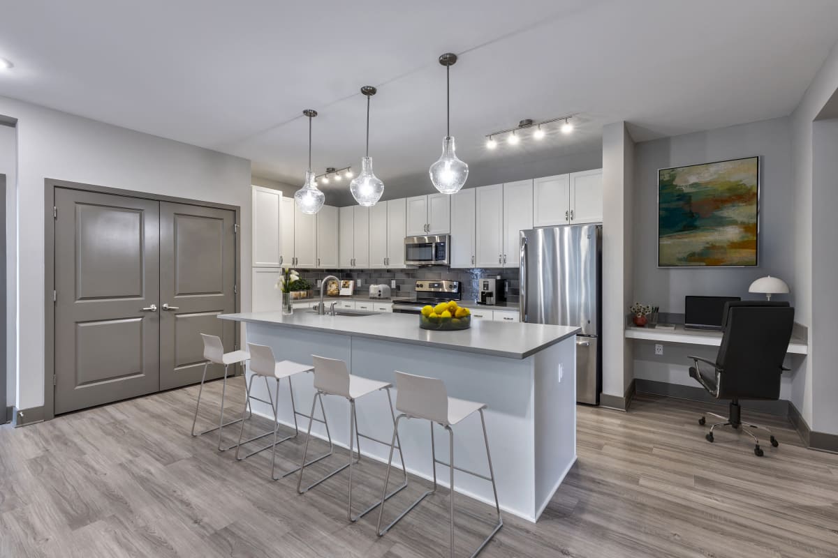Vintage Century Farms Apartments kitchen with white cabinets and island - Antioch, TN