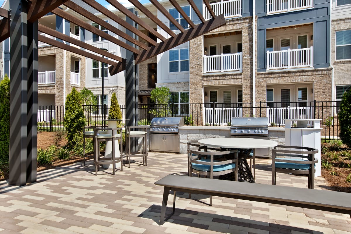 Celadon on Club Apartments outdoor pavilion patio with grilling area - Lawrenceville, GA