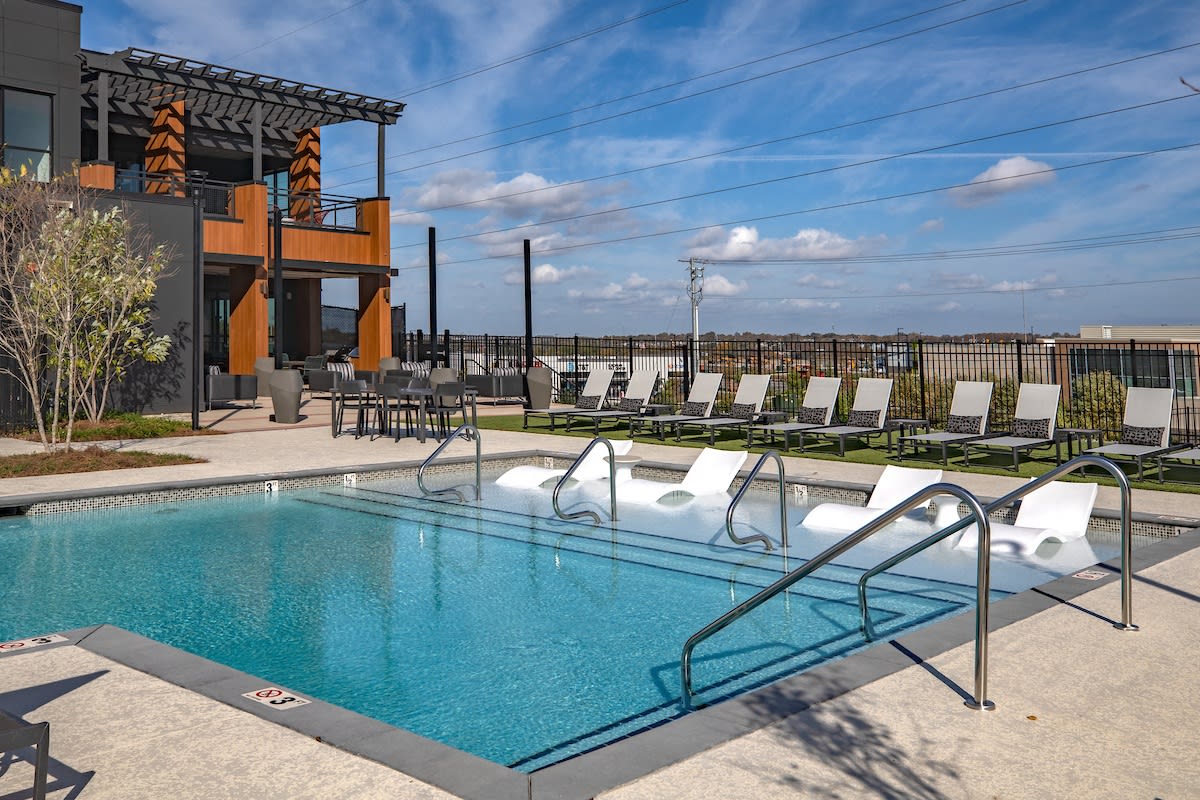 Mainstead at Century Farms Apartments rooftop pool with lounge chairs - Antioch, TN