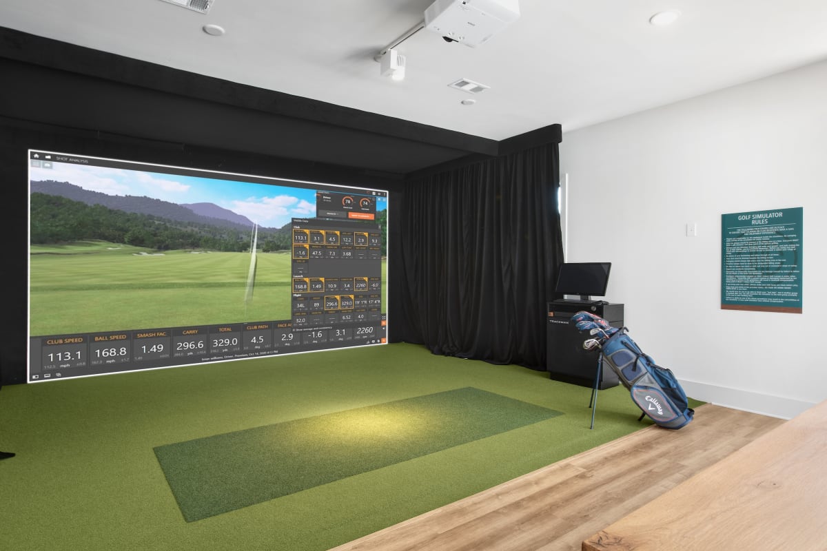 Celadon on Club Apartments golf simulator room - Lawrenceville, GA