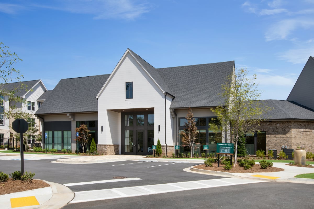 Celadon on Club Apartments exterior with community sign - Lawrenceville, GA